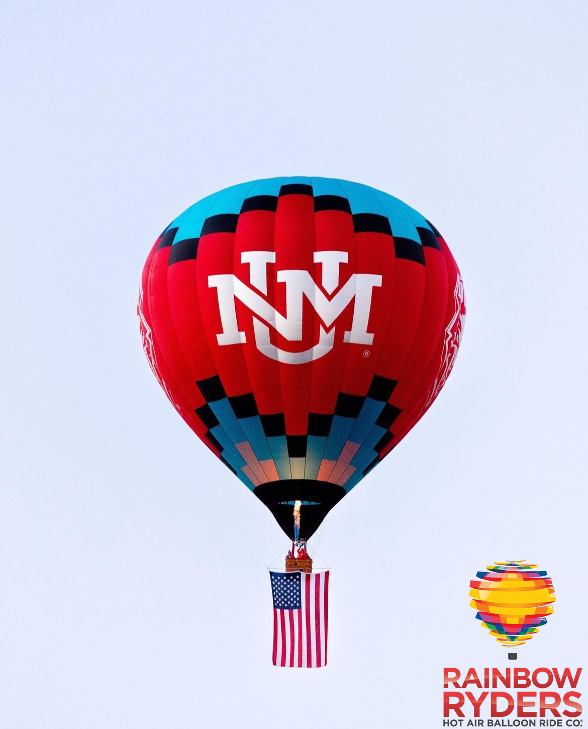 Cherry on Top, UNM branded hot air balloon, in flight with Rainbow Ryders Hot Air Balloon Ride Co. logo in corner.