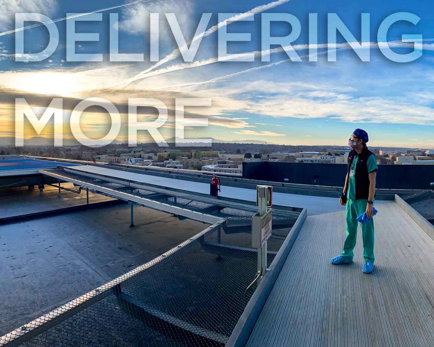 a doctor stands next to the helipad at UNM critical care tower