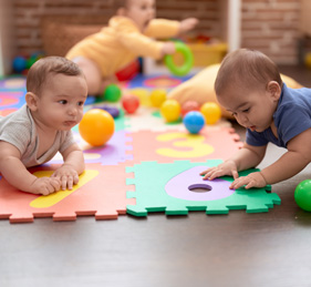 toddlers playing in a colorful playroom