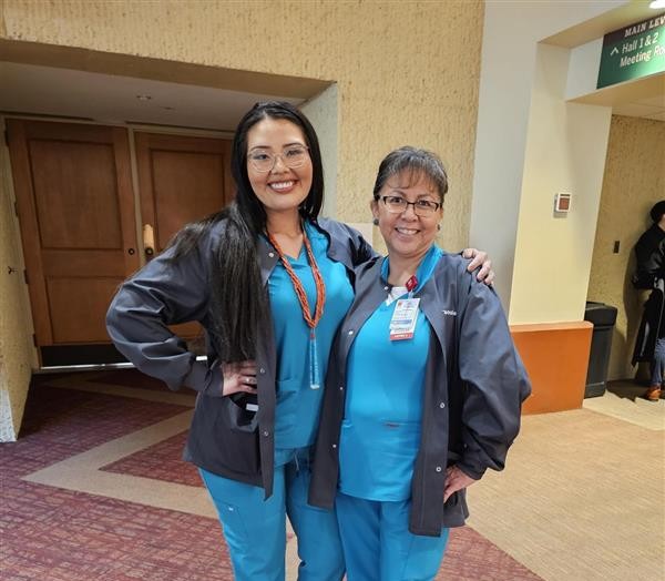 Student receiving blanket during graduation ceremony