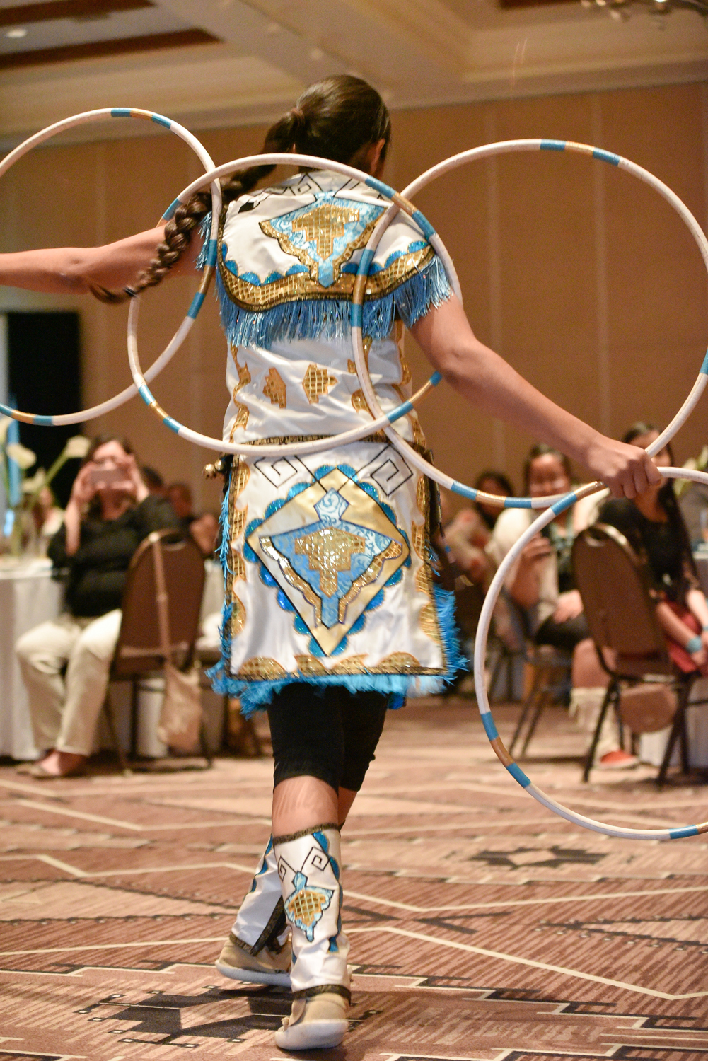 Ms. Sha De Phae Young performing the hoop dance.