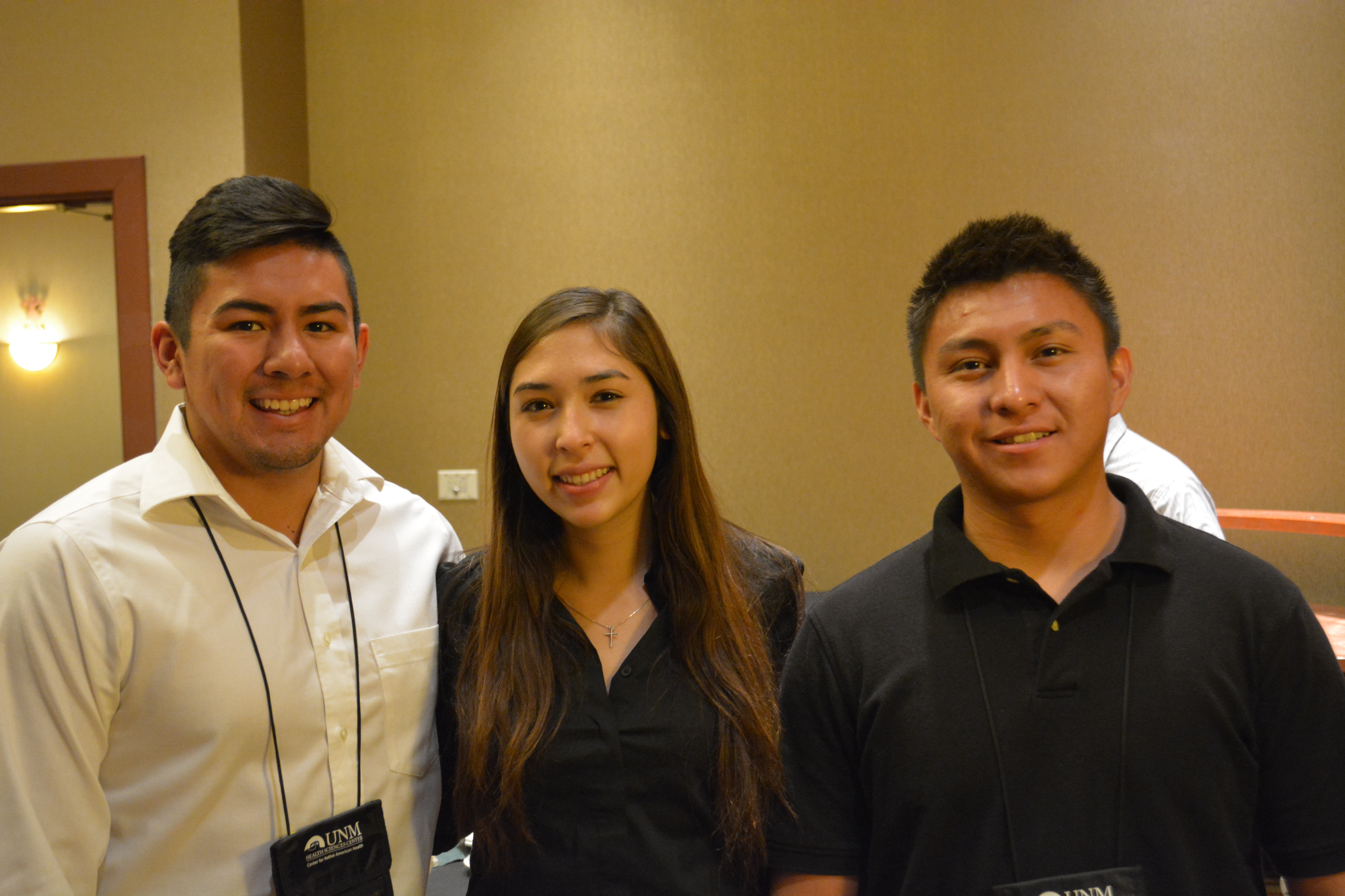 3 participants standing together.