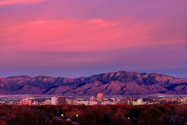 Downtown Albuquerque and the Sandia mountains at sunset