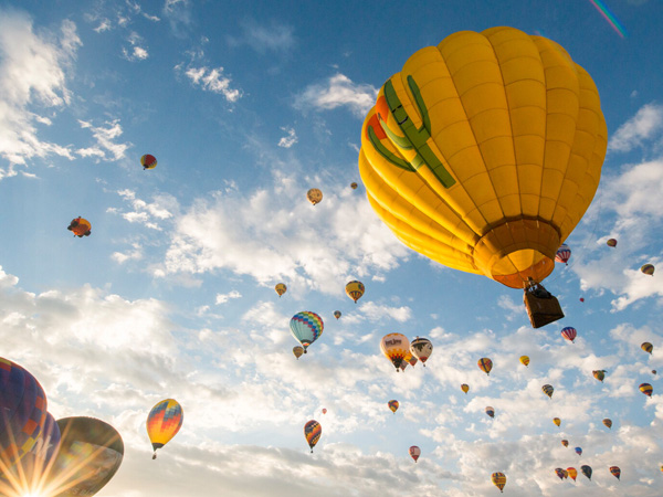 Hot air balloons lifting off.