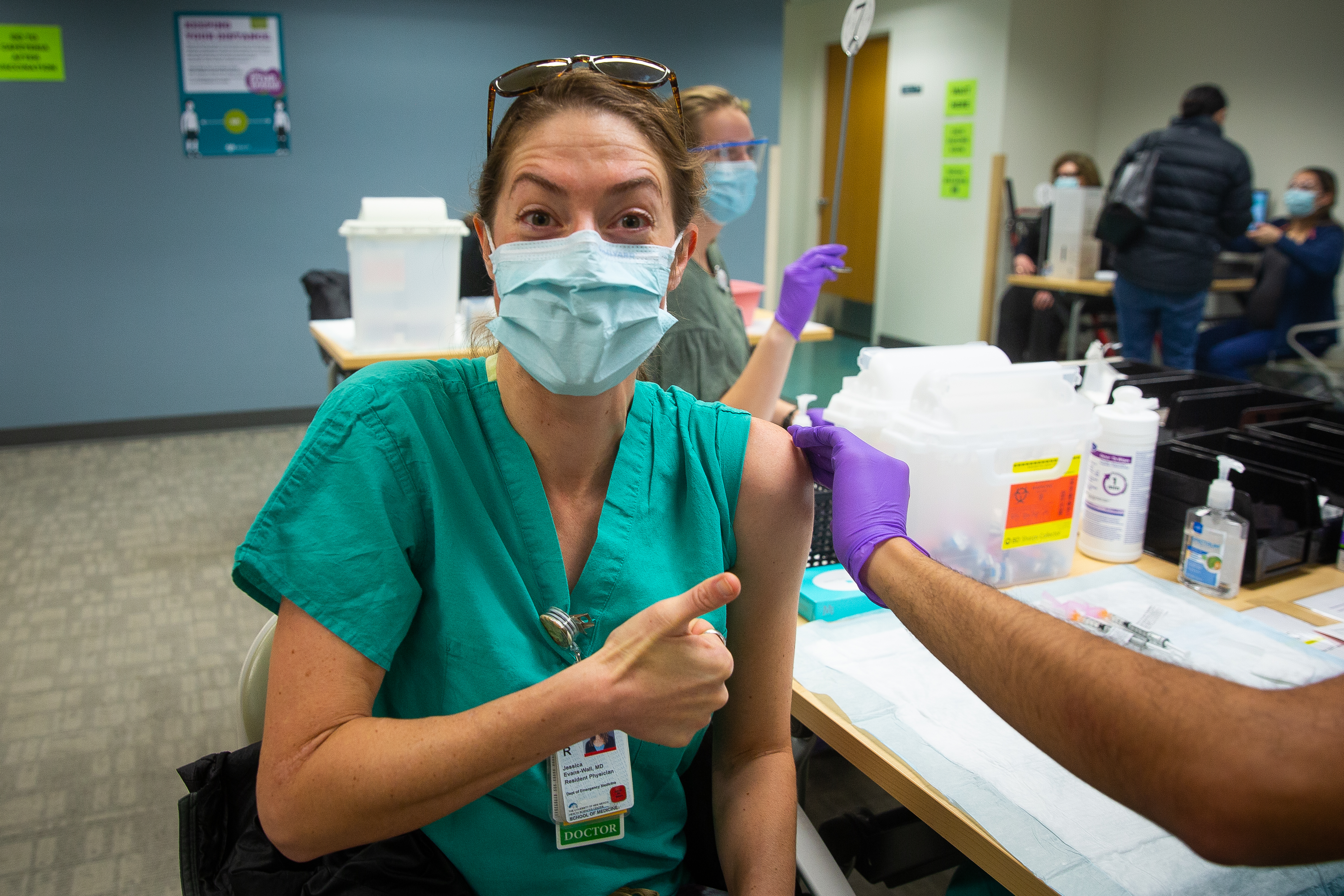 Thumbnail is UNM employee receiving vaccine and the banner is the 10 to 100 logo