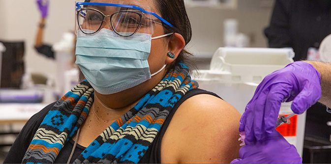 A person getting their COVID vaccine
