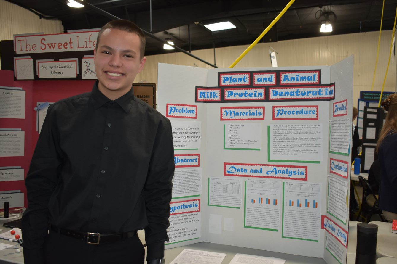 A young researcher showing his research