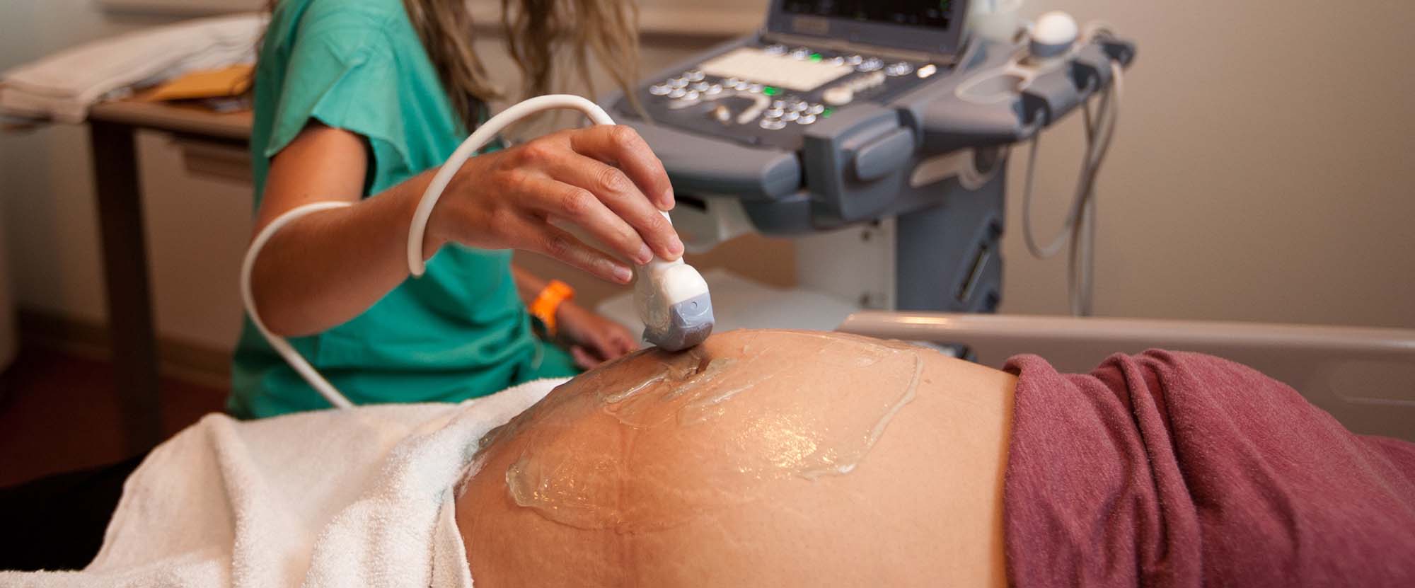A pregnant mother undergoing an ultrasound