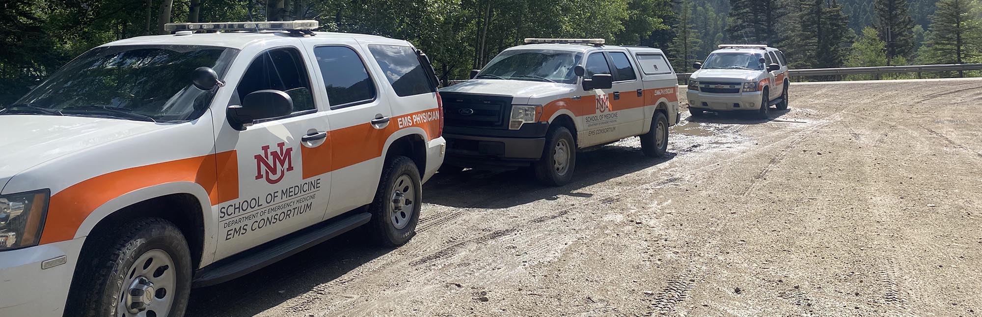 UNM EMS vehicles in the mountains
