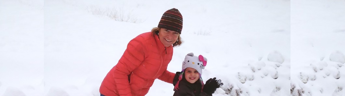 Sabrina Hopkins with her daughter in the snow