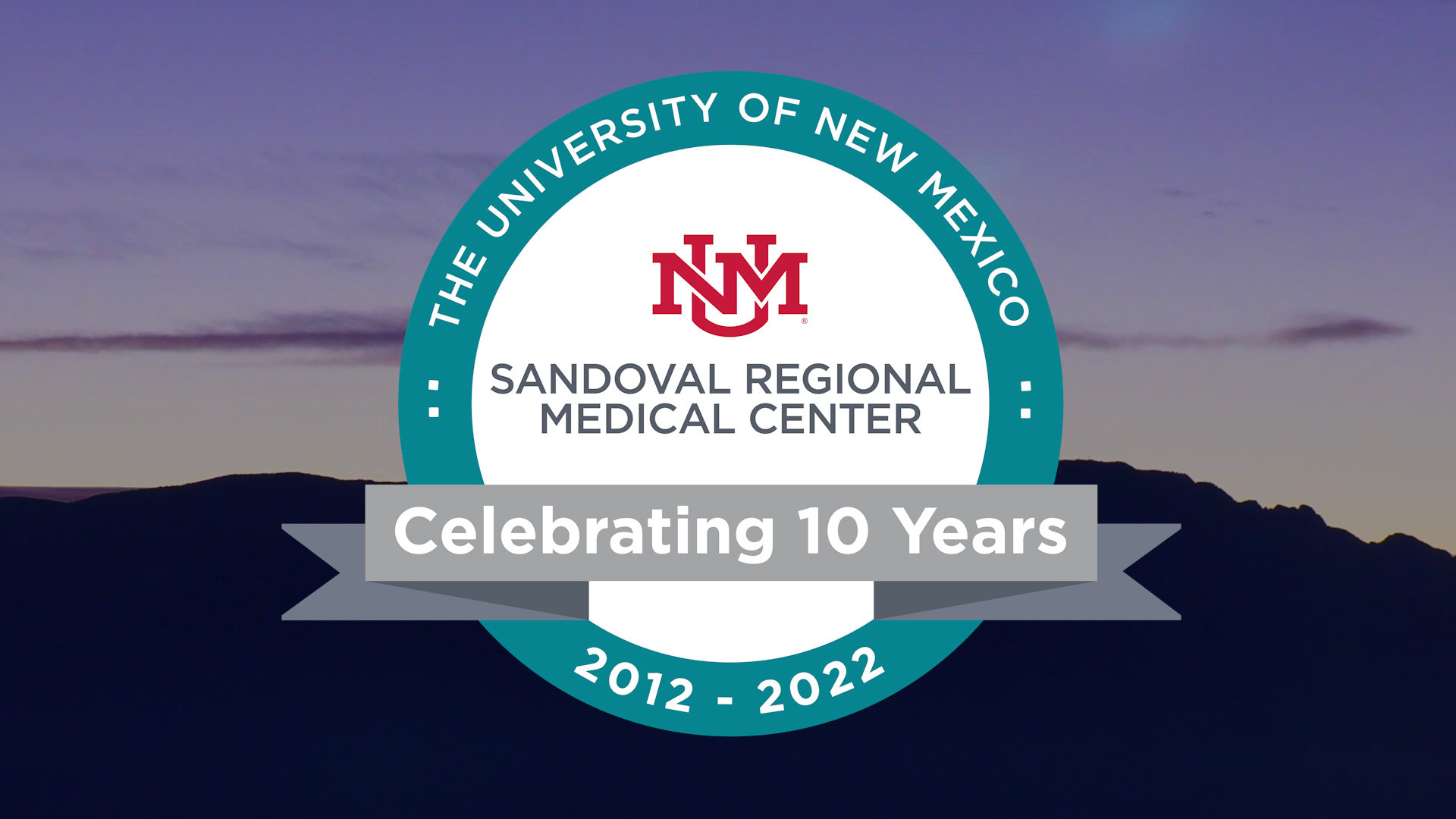 Sandoval Regional Medical Center 10th Anniversary graphic, banner is the SRMC lobby
