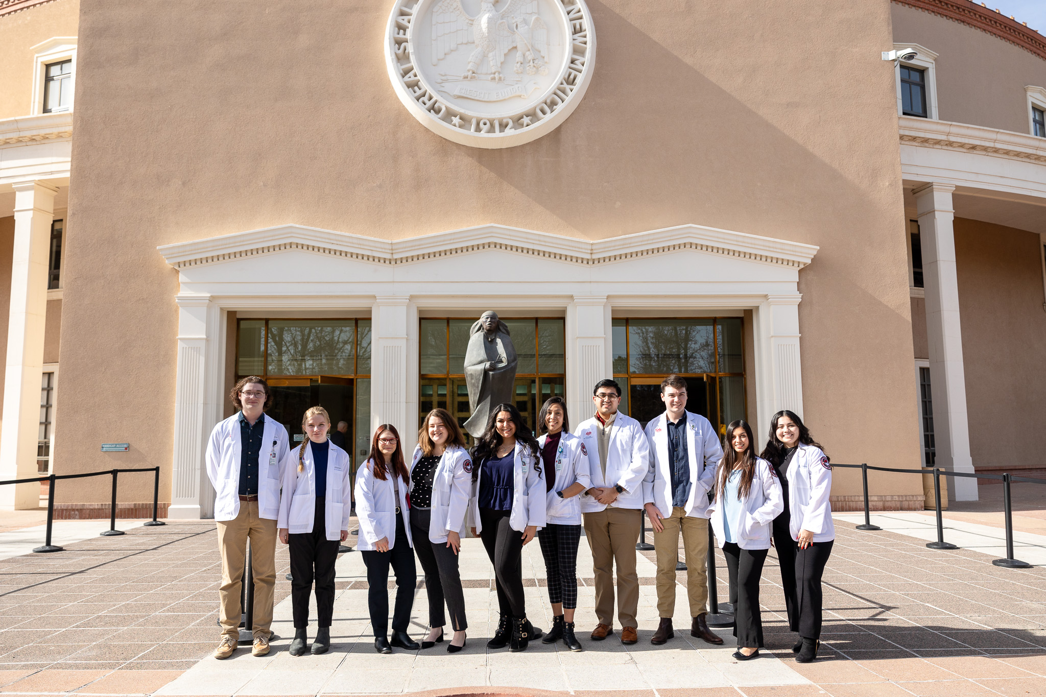 UNM pharmacy students standing outside Roundhouse
