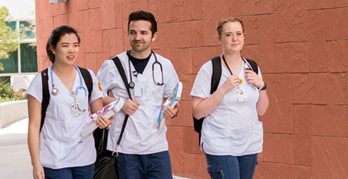 Nursing students walking on campus.