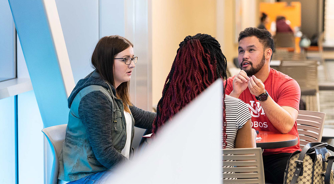 students in hall talking