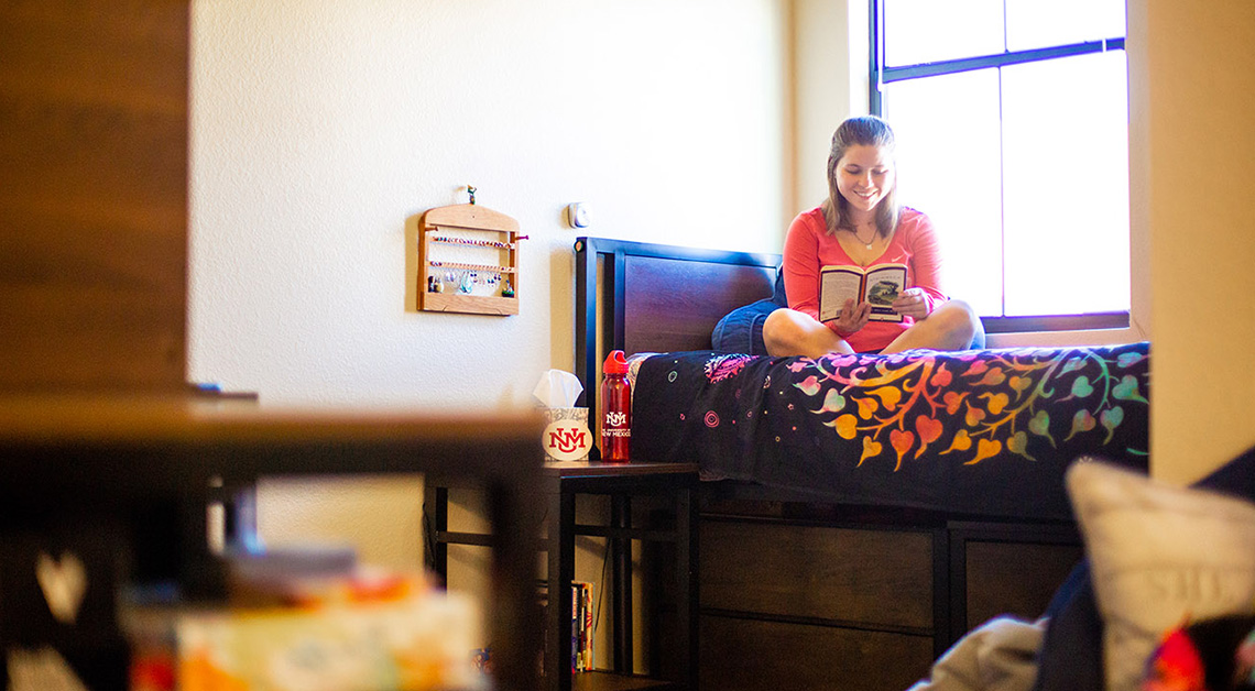 student studying on bed