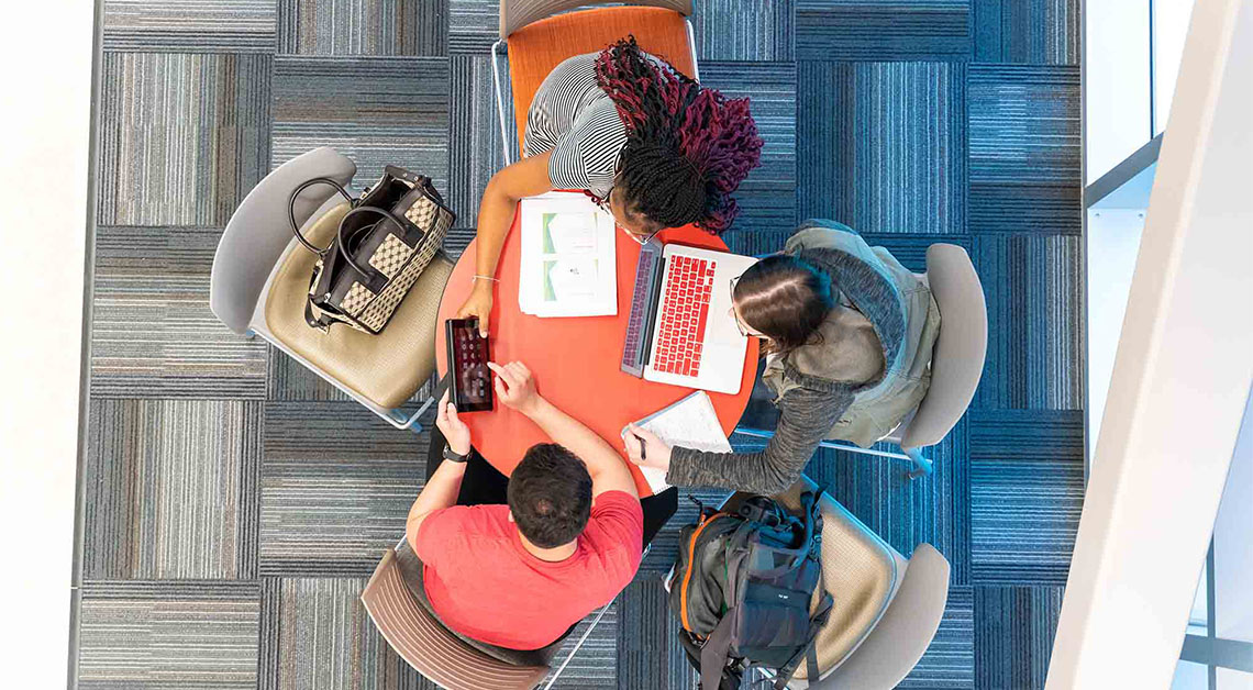 3 students at a table