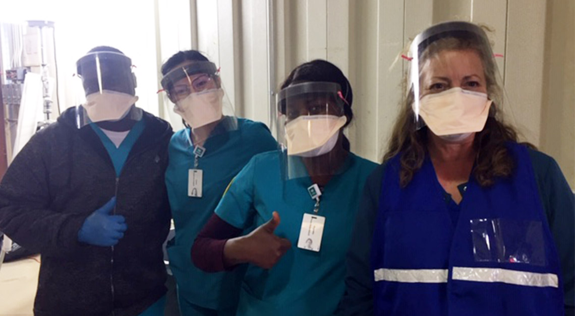faculty and students in full ppe