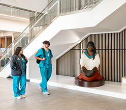 2 students walking inside