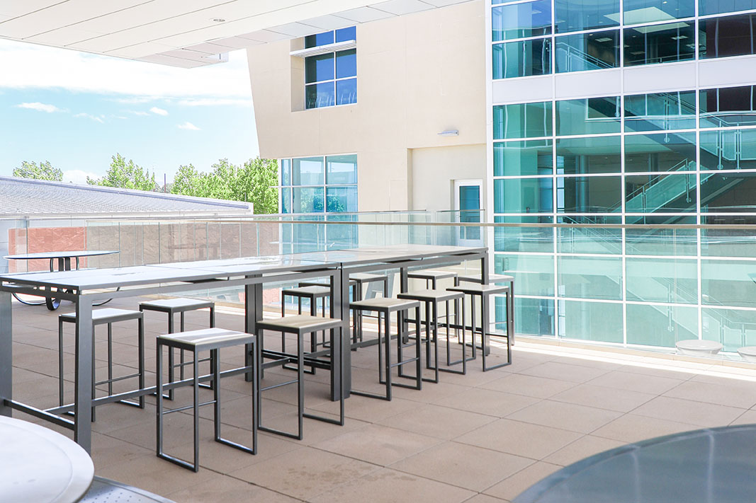 Tables and chairs on patio.