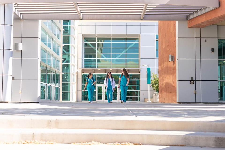 3 students walking.