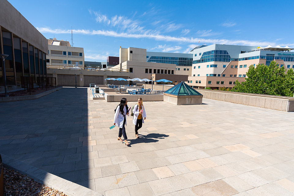 Nursing students walking across campus.