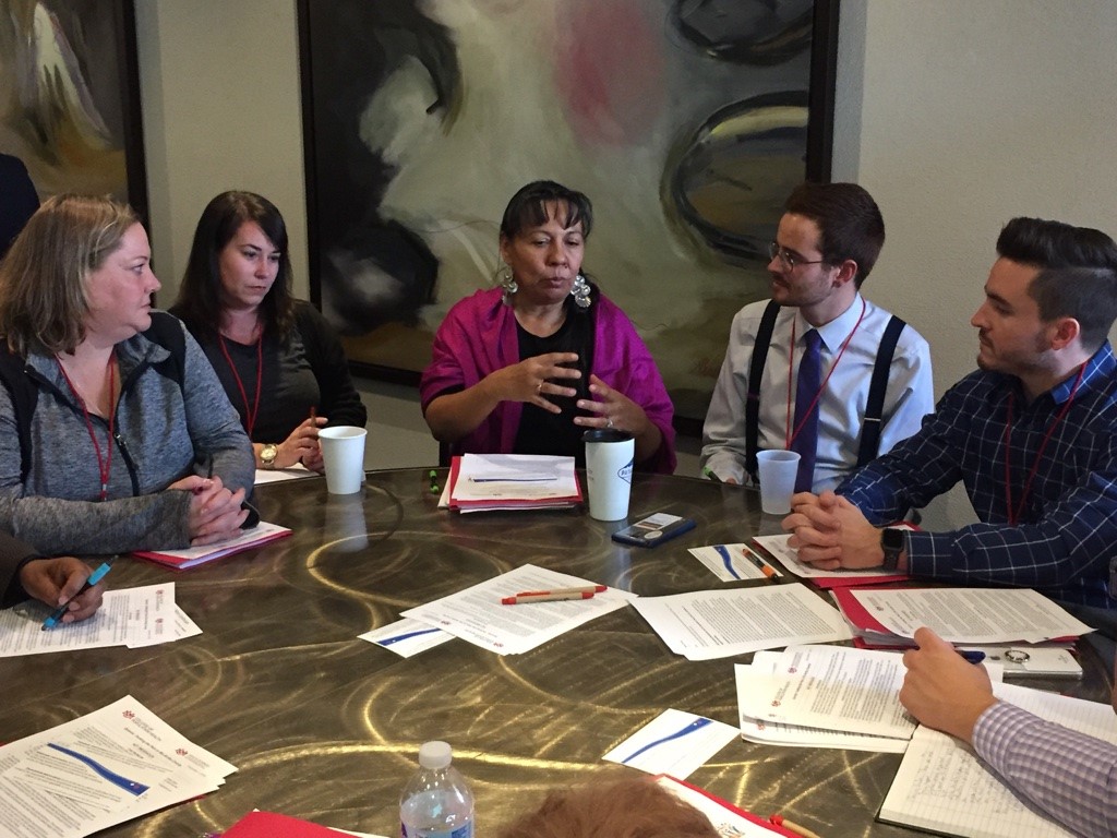 Small group discussion around table